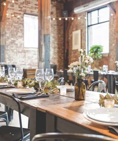 The Feed Co. Table & Tavern dining room set for the evening